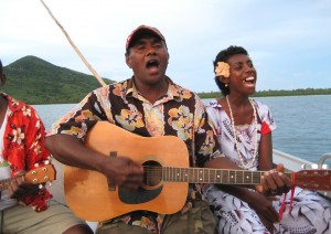 Seruvi and Grace singing on the boat